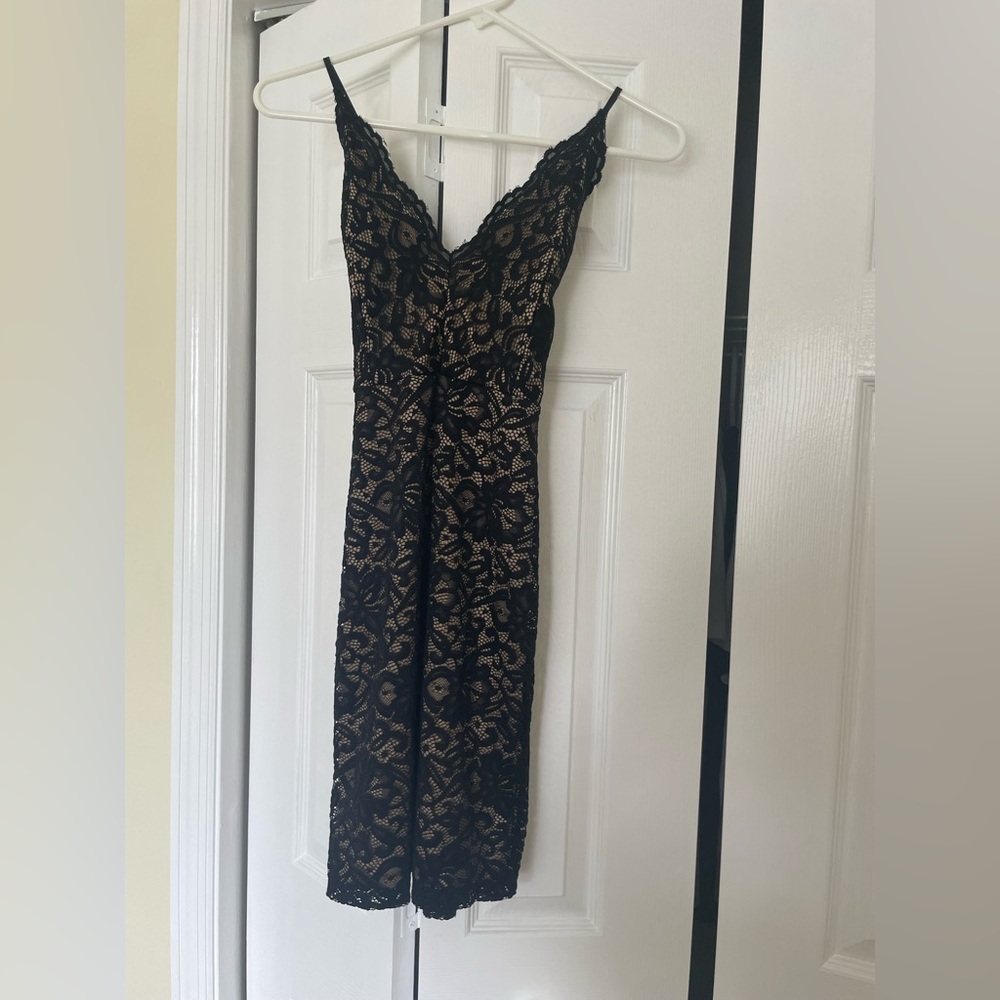 Tight black lace dress. Size small. Worn once.